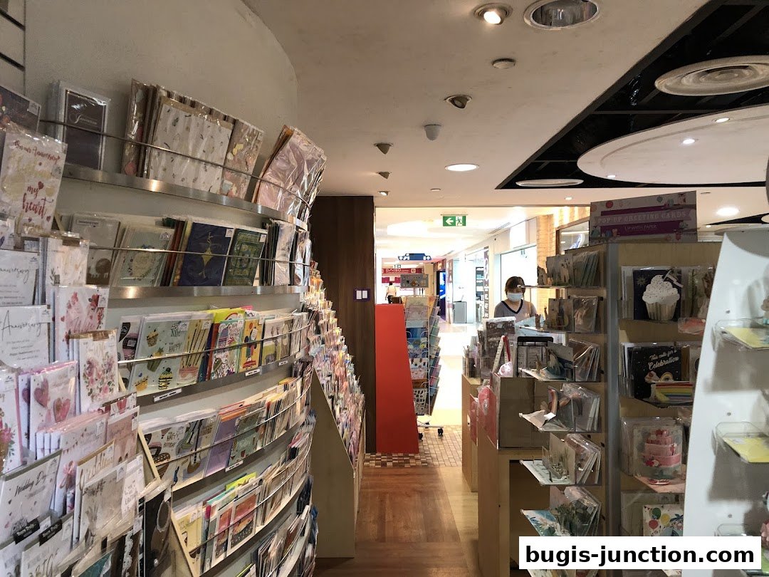 Interior view of a stationery shop with shelves full of greeting cards and gifts.
