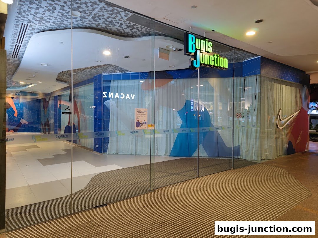 The entrance to a Nike store at Bugis Junction, featuring large glass windows and the iconic Nike swoosh.
