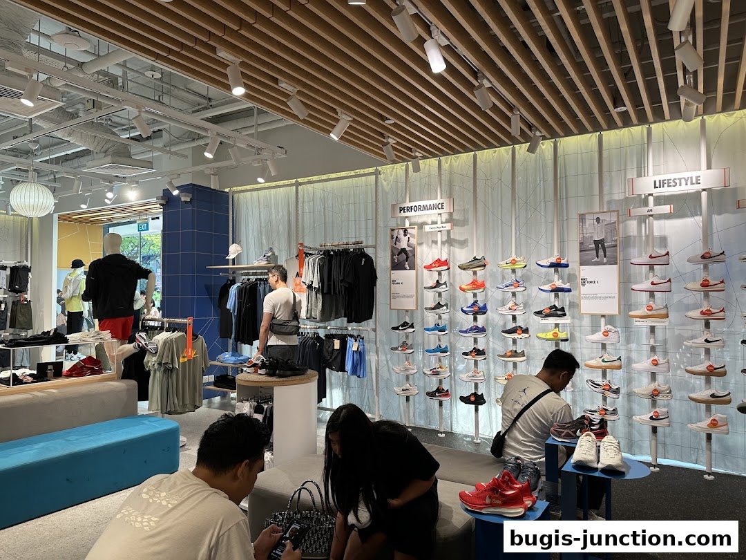 Interior of a Nike store showcasing a wide selection of athletic footwear and apparel.