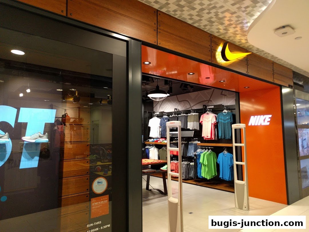 The entrance to a Nike store, showcasing apparel and footwear with prominent branding.