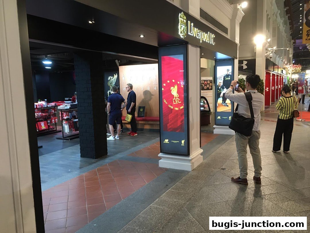 The entrance of the Official Liverpool FC Retail store with merchandise and displays.