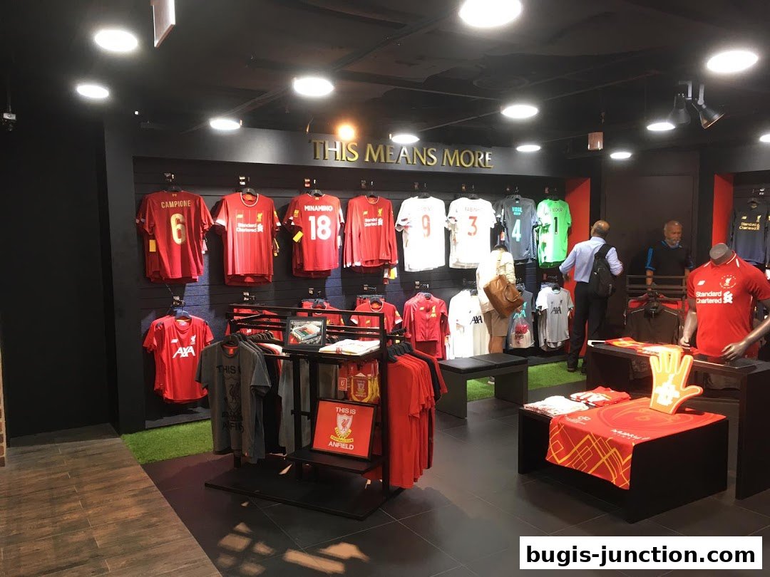 Interior of a Liverpool FC retail store showcasing various team jerseys and merchandise.