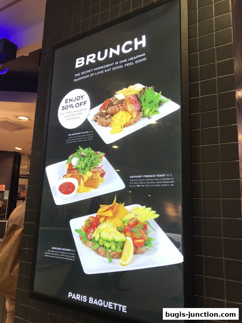 A digital menu board showcasing three brunch dishes with prices and descriptions.