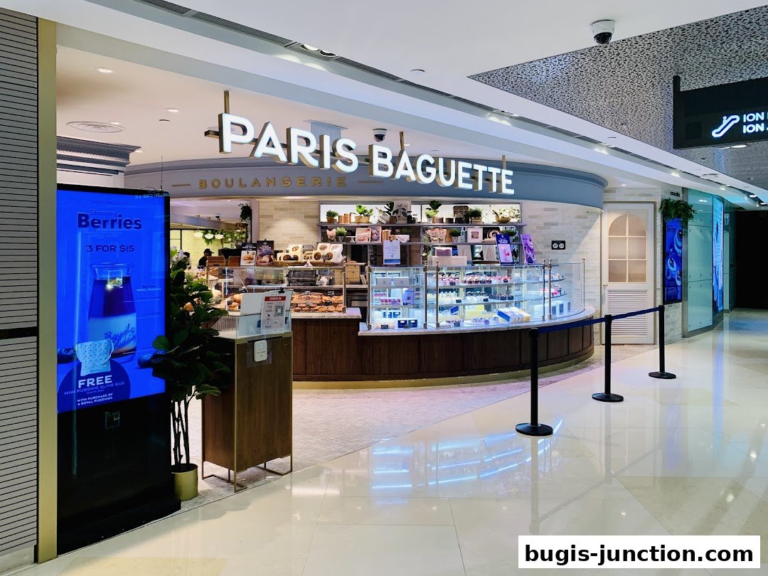 Paris Baguette Boulangerie shop with display cases filled with pastries and cakes.