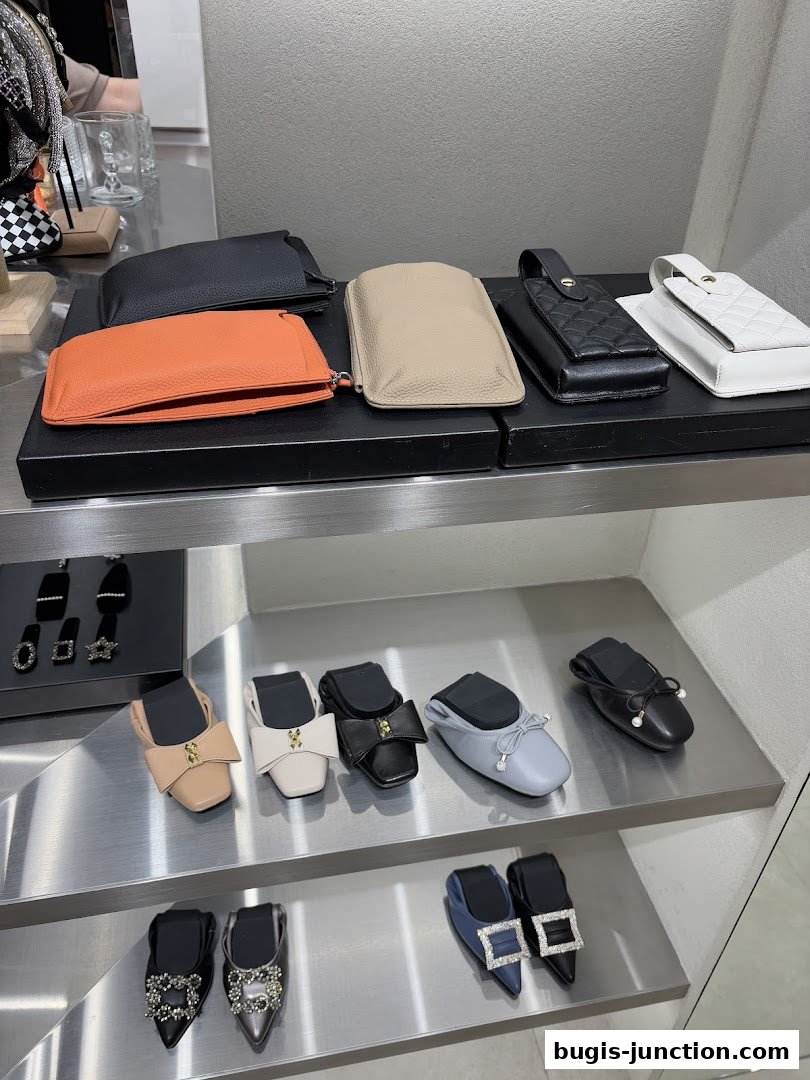 A display of elegant women's shoes and accessories on shelves.