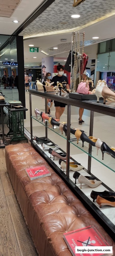 A display of stylish women's shoes and handbags at PAZZION Bugis Junction.
