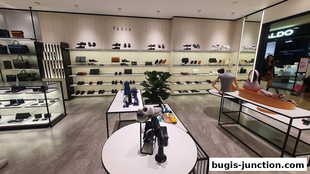Interior view of a Pedro shoe and bag store showcasing a wide selection of footwear and accessories.