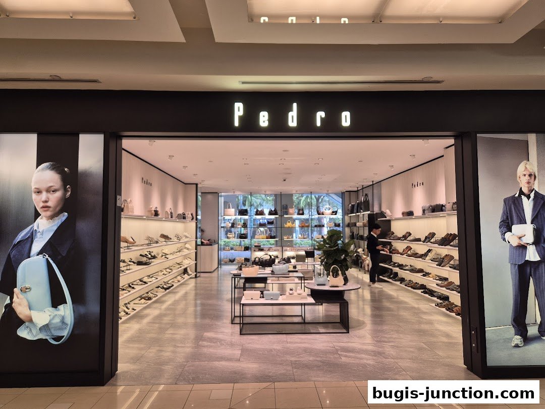 The entrance of a Pedro shoe and bag store, showcasing stylish footwear and handbags.