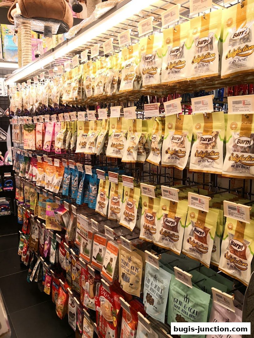 Shelves stocked with various pet treats and food products, neatly displayed.