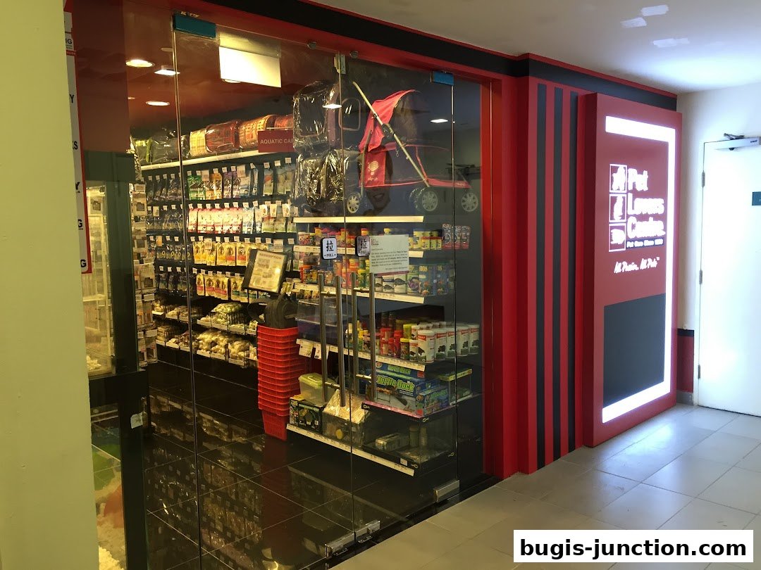 The entrance of Pet Lovers Centre, a pet supply store, showcasing shelves stocked with pet food and accessories.