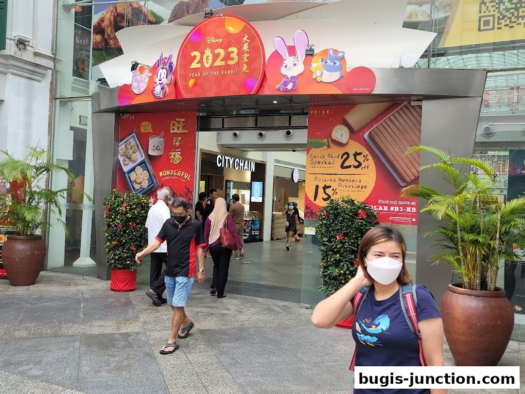 A shop entrance decorated for the Year of the Rabbit with Disney characters and promotional posters.