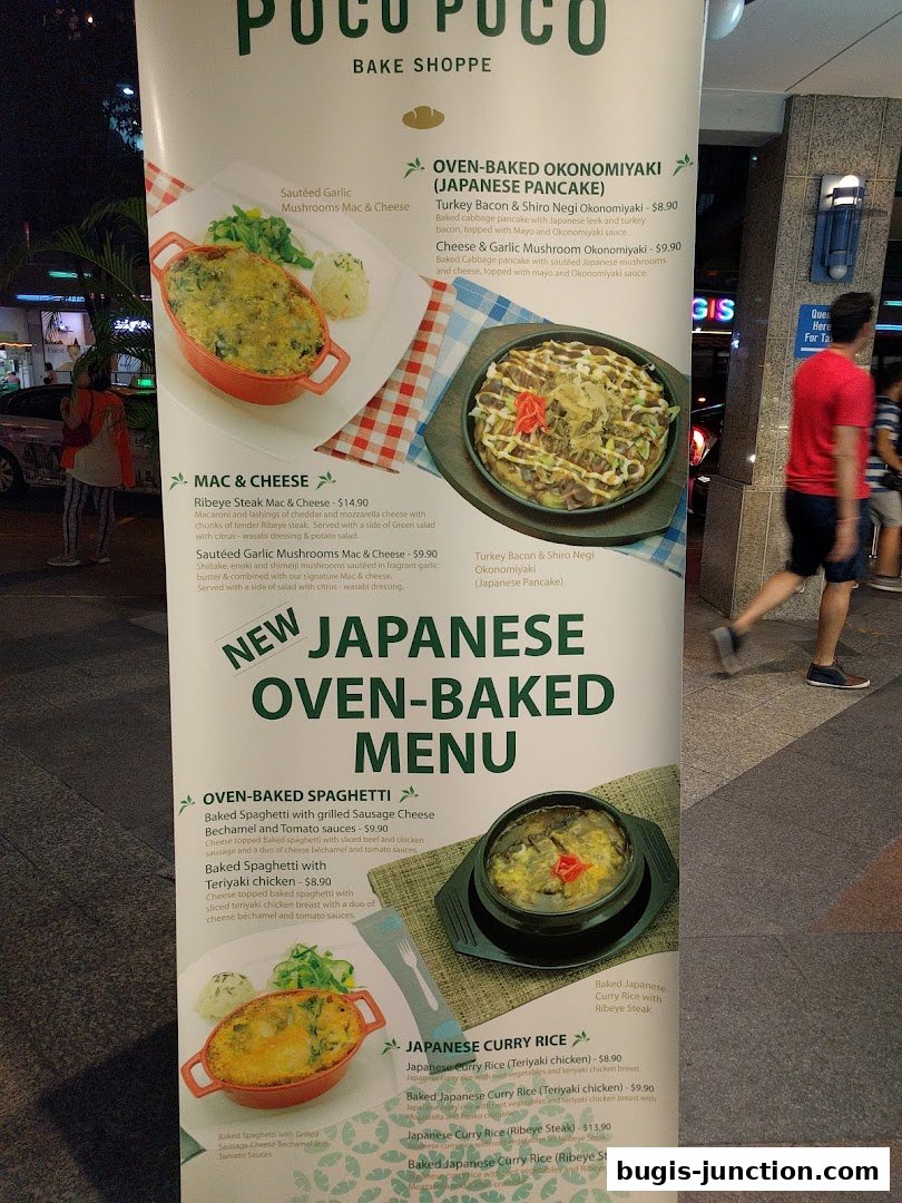 A menu board for Poco Poco Bake Shoppe showcasing Japanese oven-baked dishes like Okonomiyaki and Spaghetti.
