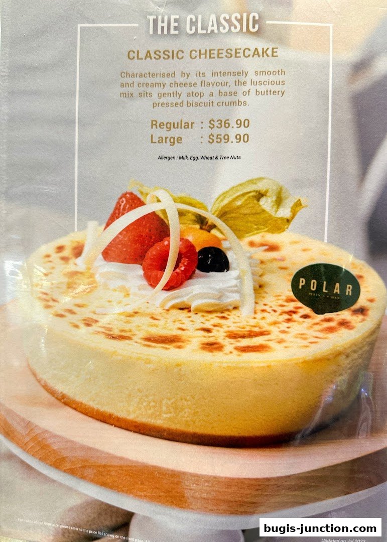 A close-up of a classic cheesecake from Polar Puffs & Cakes with fruit toppings.