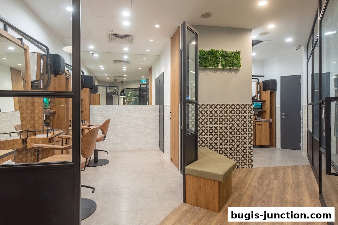 Interior view of a modern salon with styling chairs, mirrors, and a waiting bench.