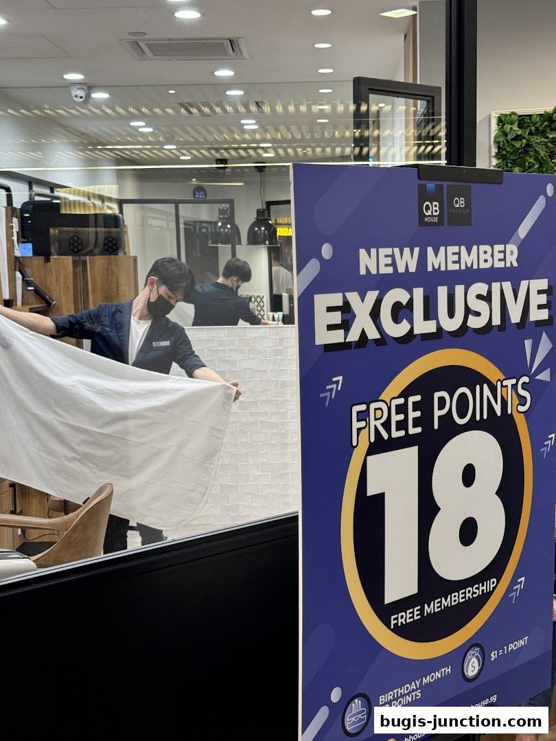 A sign advertises free points for new members at QB Premium Bugis Junction.
