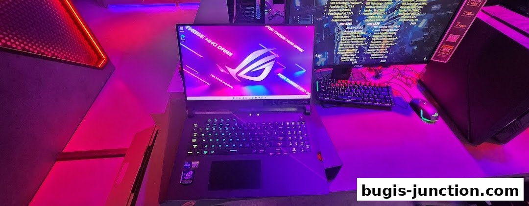 A gaming laptop and monitor setup with RGB lighting in a ROG Experience Store.