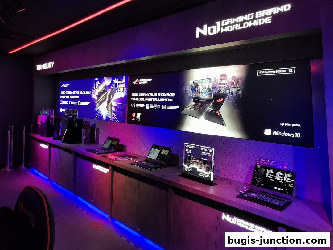 ROG Experience Store showcasing gaming laptops and PC components with vibrant lighting.