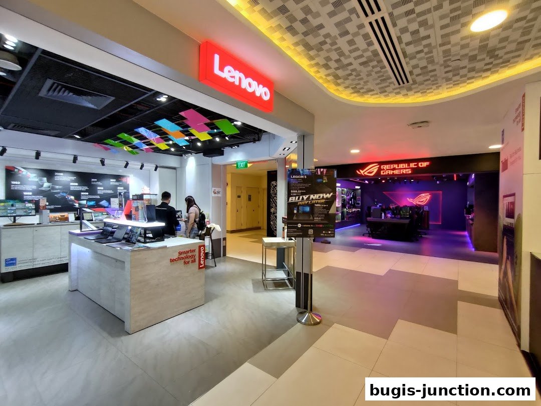 Interior view of a Lenovo and ROG Experience Store with products and staff.
