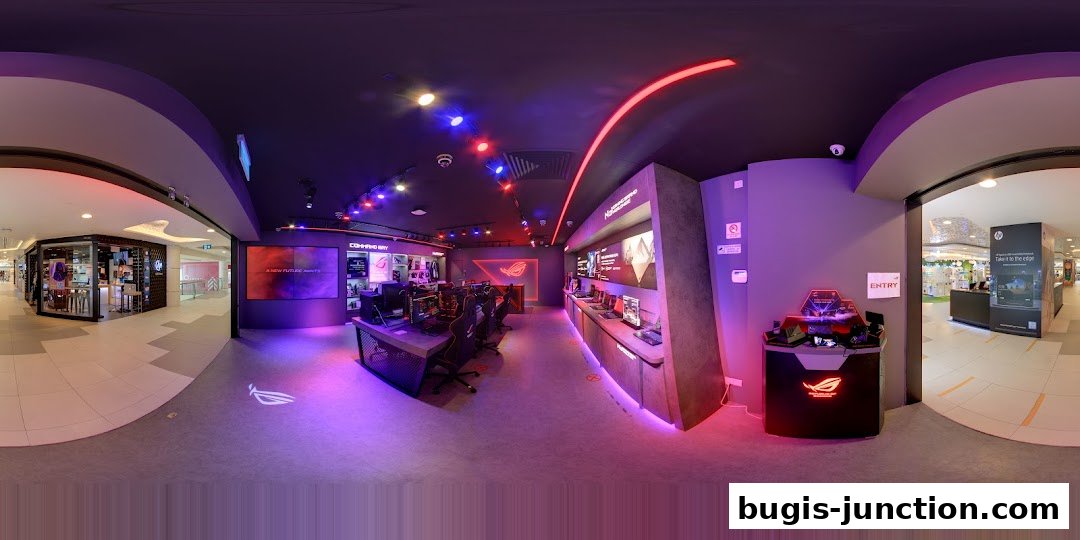 Interior view of the ROG Experience Store showcasing gaming setups and products with vibrant lighting.
