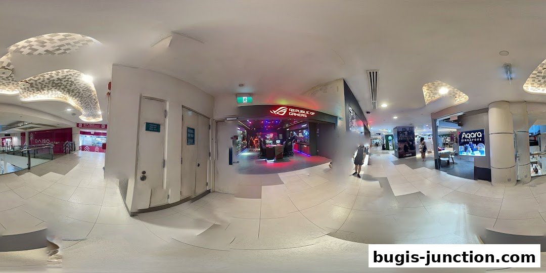 The ROG Experience Store entrance with neon lighting and gaming setups visible inside.