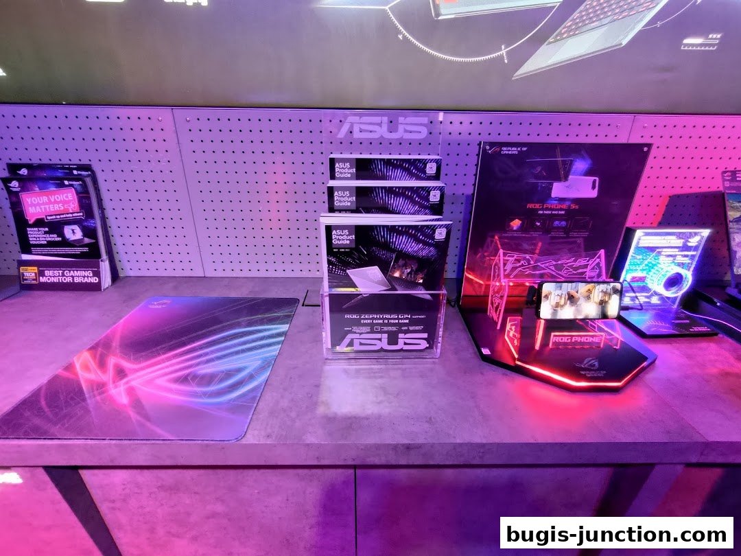 ROG Experience Store display featuring gaming products, including a ROG Phone and product guides.