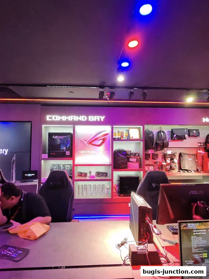 Interior of a ROG Experience Store showcasing gaming PCs, chairs, and accessories.