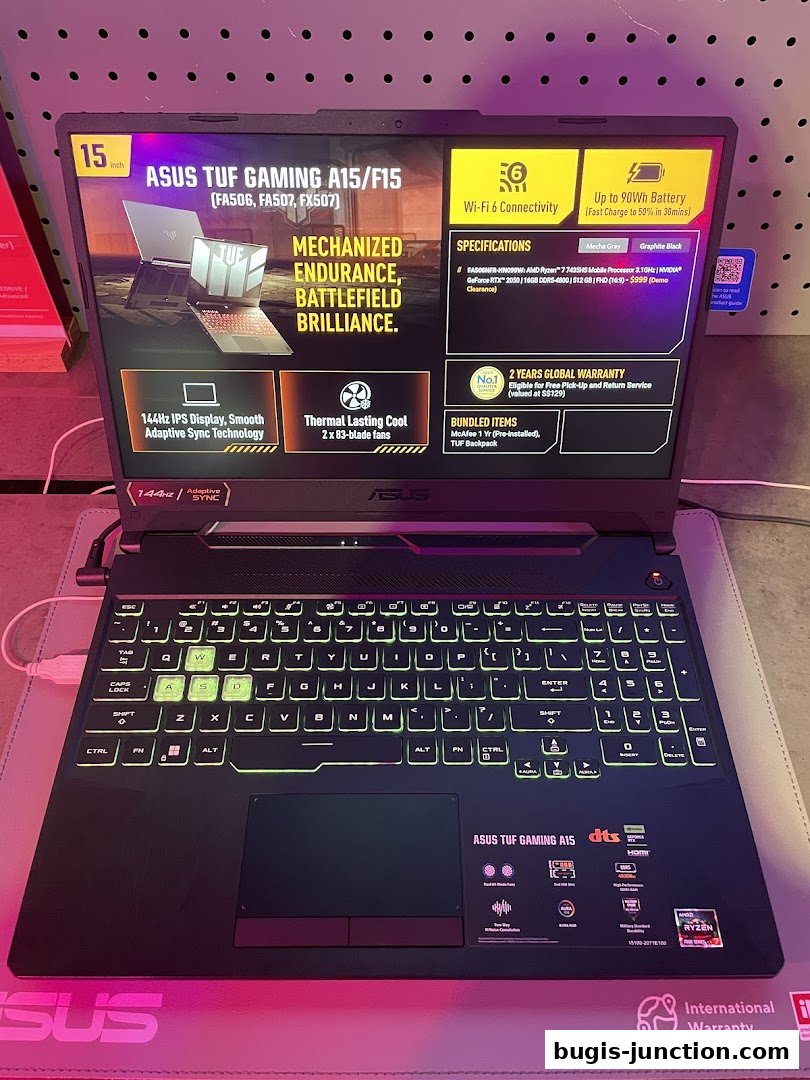 A close-up view of an ASUS TUF Gaming laptop with its screen displaying specifications and features.