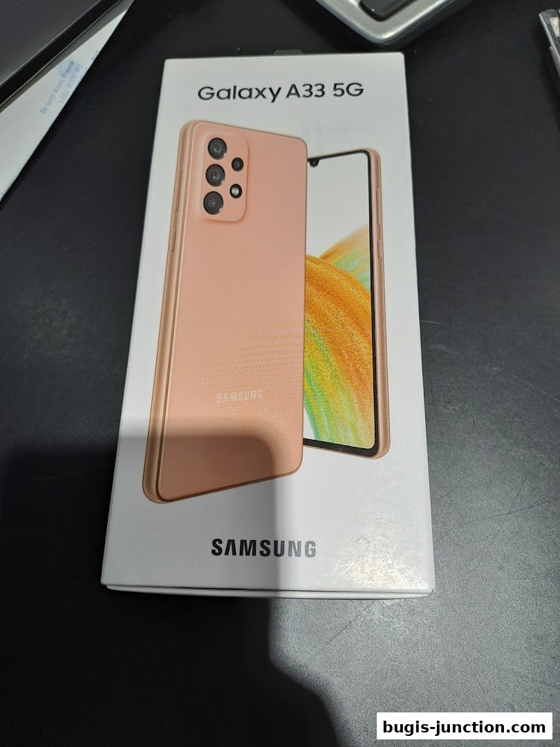A box for the Samsung Galaxy A33 5G smartphone in a peach color.