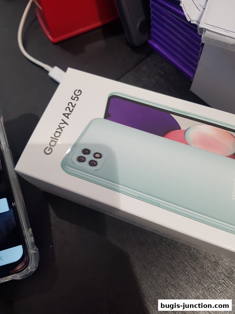 A Samsung Galaxy A22 5G phone box with a phone and charger.