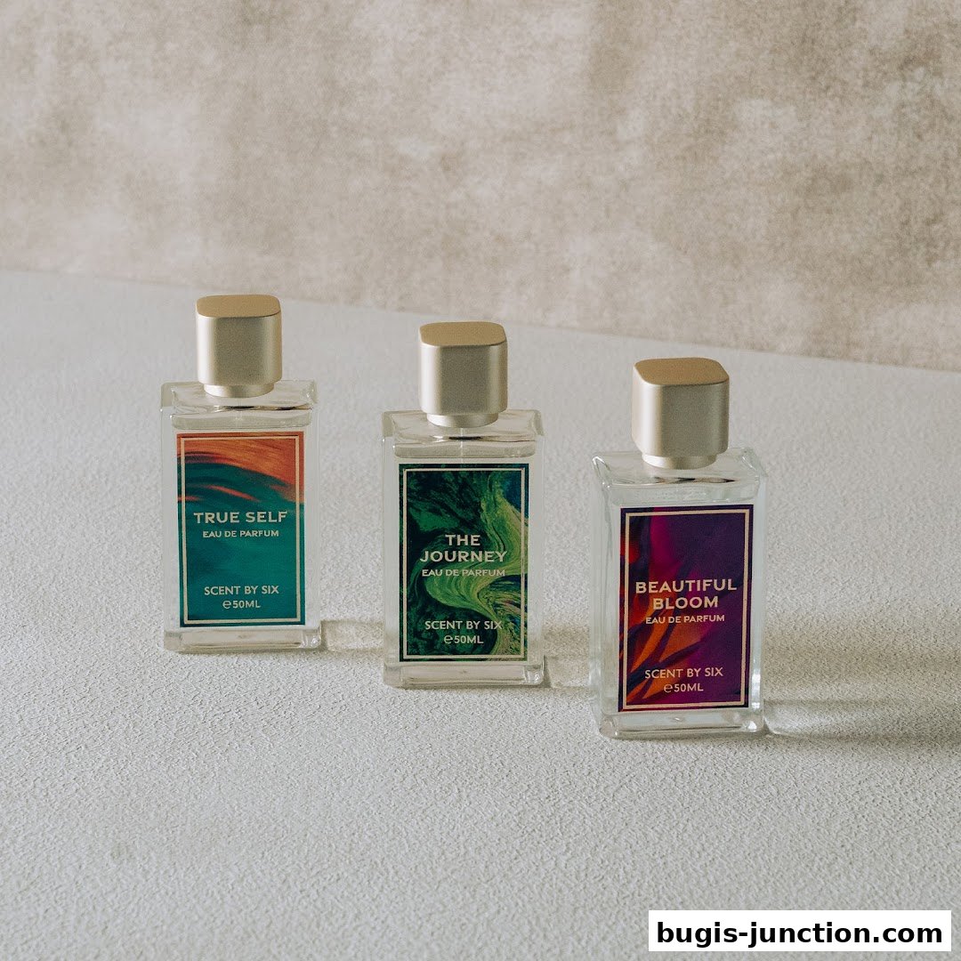 Three elegant perfume bottles with distinct labels and golden caps are displayed.