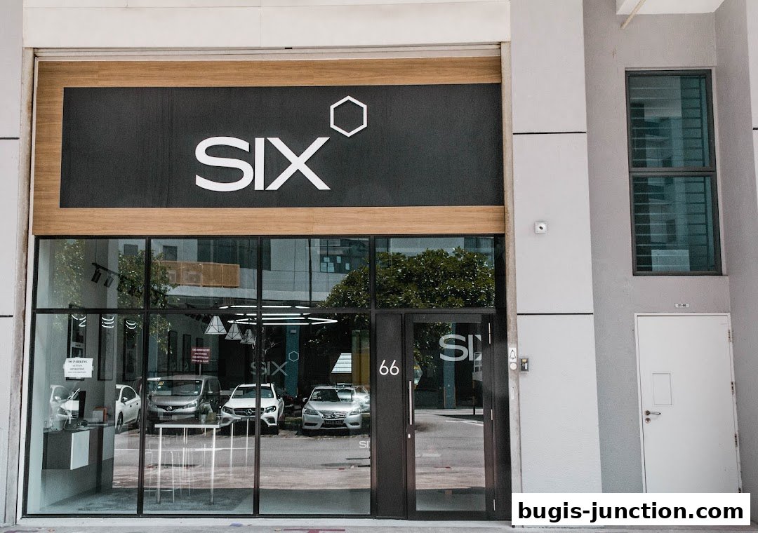 The modern storefront of Scent by SIX Bugis Junction features a large black sign with white lettering and a hexagonal logo.