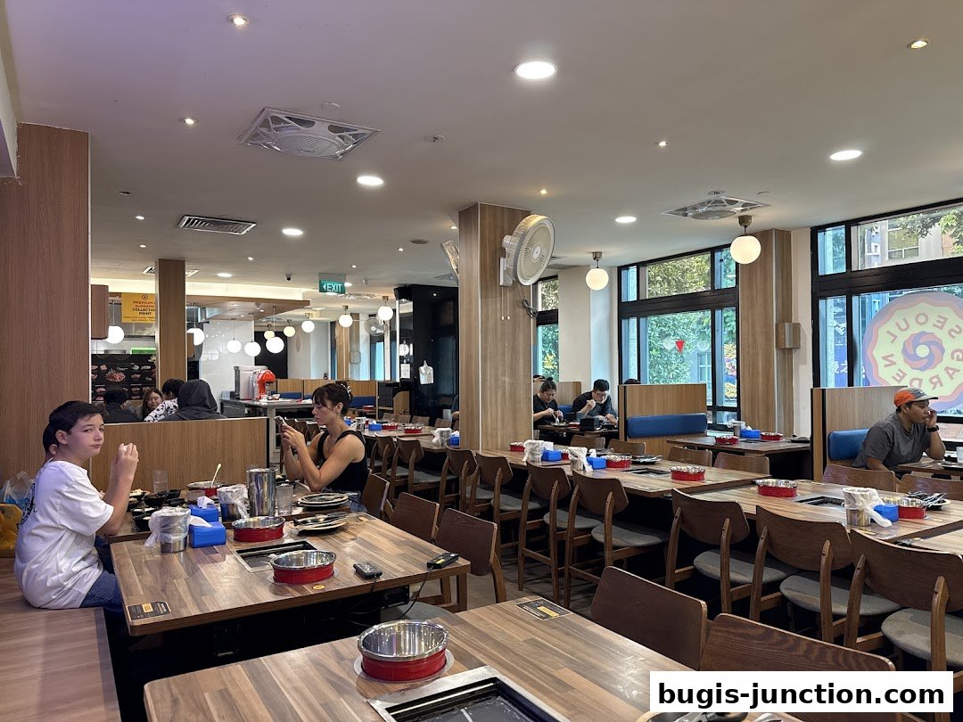 Interior view of Seoul Garden restaurant with diners seated at tables.