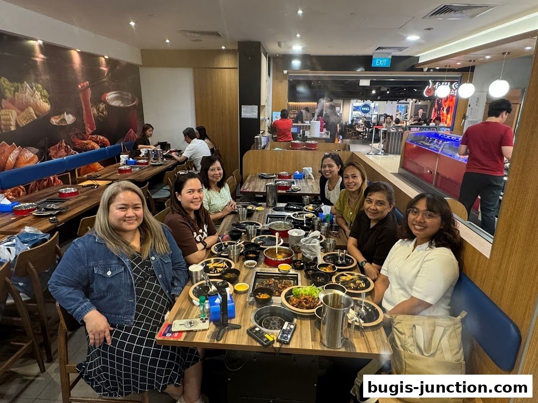 A group of people enjoying a meal at Seoul Garden, a Korean BBQ restaurant.