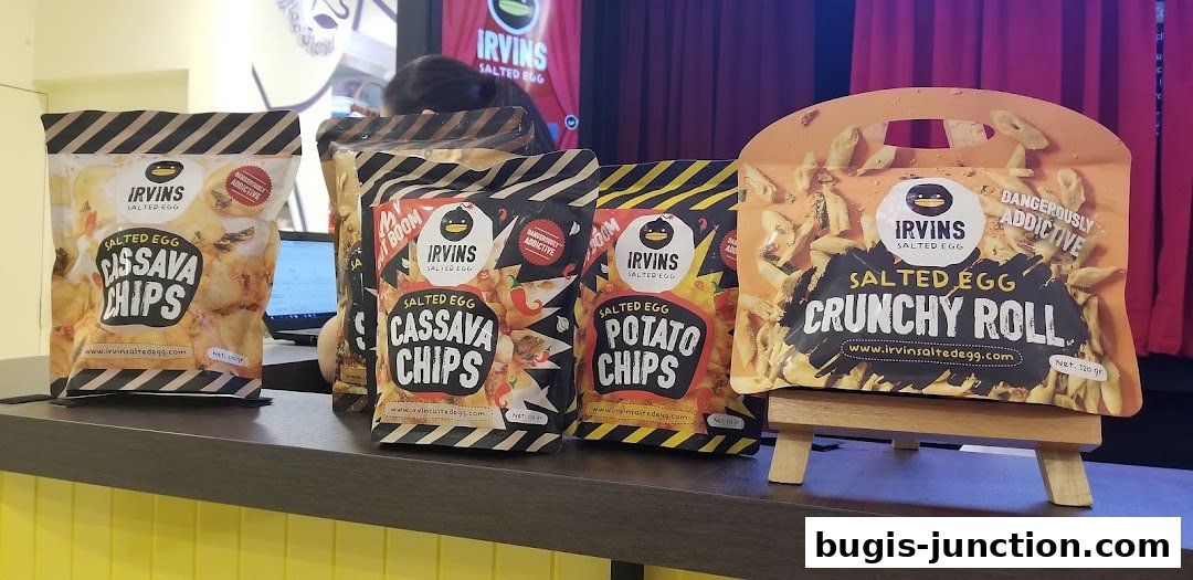 Assortment of Irvins Salted Egg snacks including Cassava Chips and Crunchy Rolls.