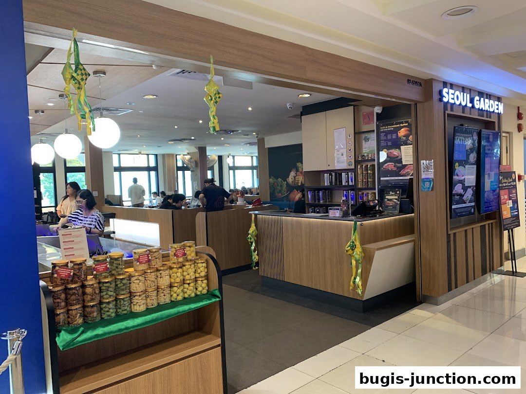The exterior of Seoul Garden restaurant with a counter and display of food items.