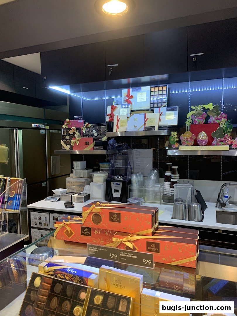 A display of Godiva chocolates and gift boxes, with some items priced.