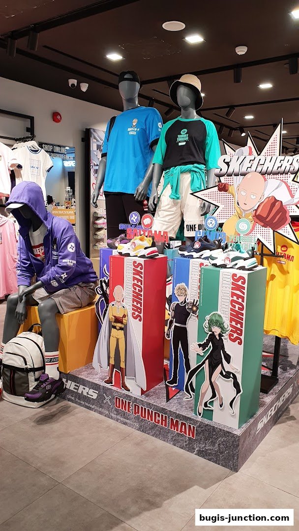 Mannequins wearing Skechers apparel and shoes, with One Punch Man characters displayed.