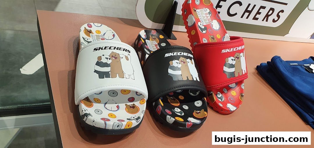 Skechers slides featuring 'We Bare Bears' characters in white, black, and red.