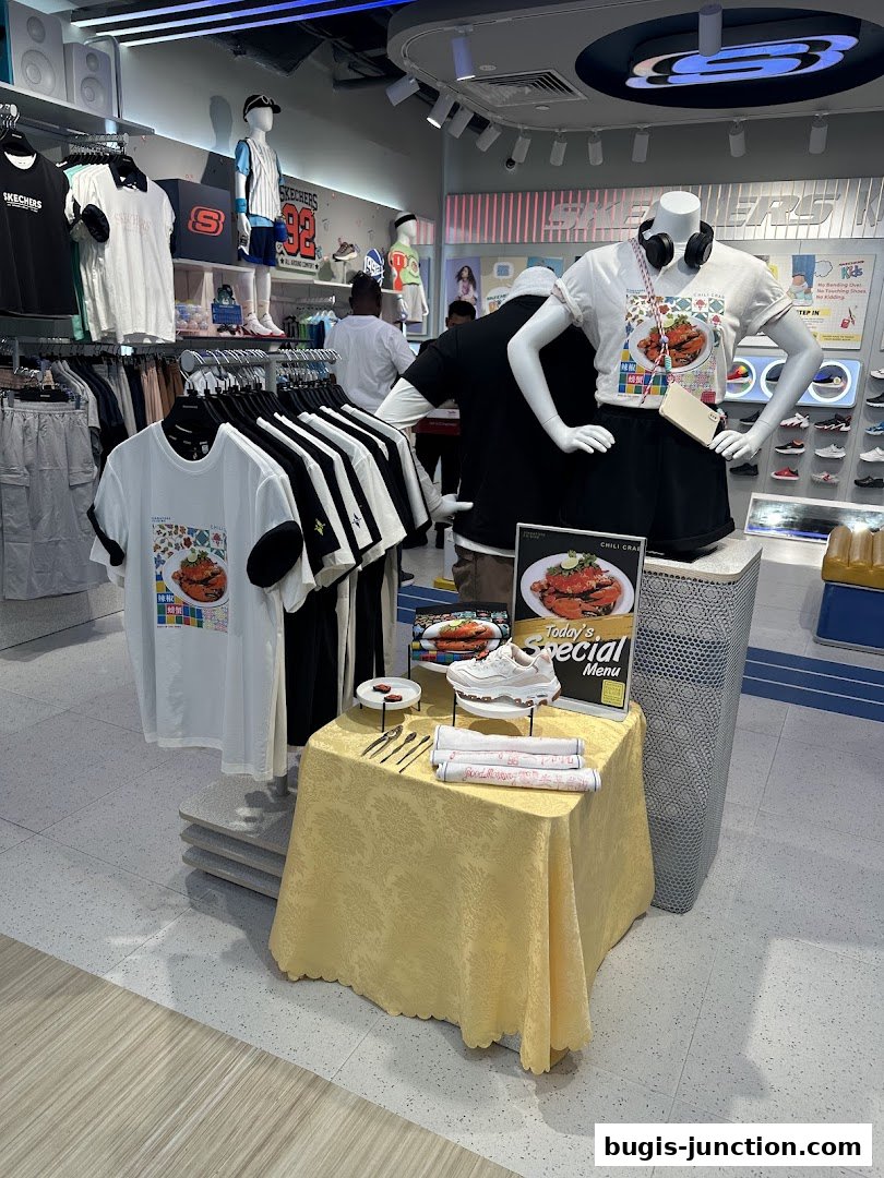Skechers store interior with mannequins displaying apparel and a special menu display.