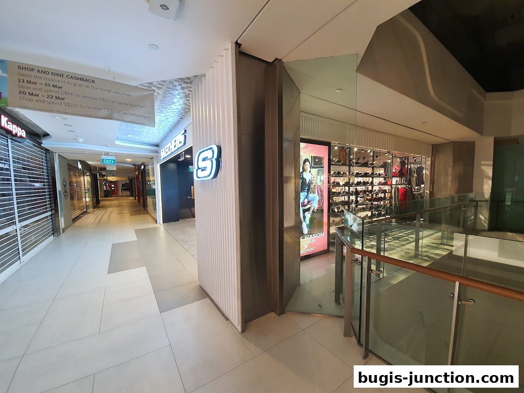 The Skechers store entrance with shoes displayed inside and a promotional banner overhead.