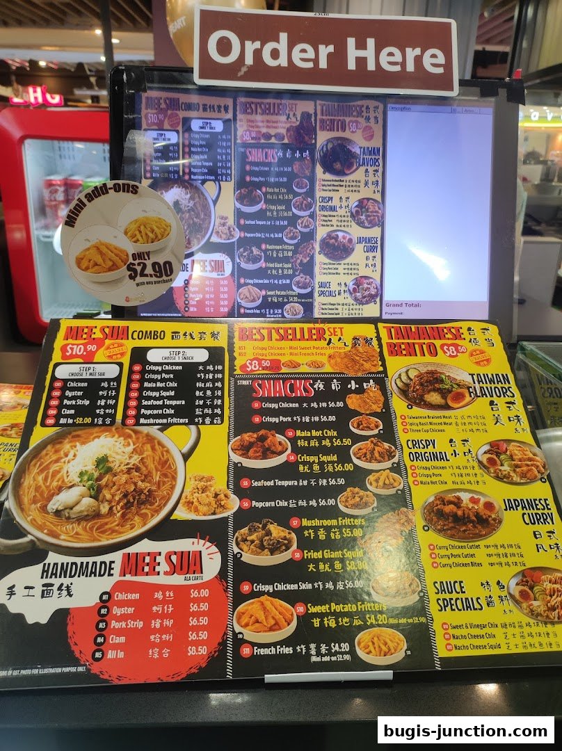 A close-up of a menu board for Snackz It! featuring various Taiwanese snacks and meals.