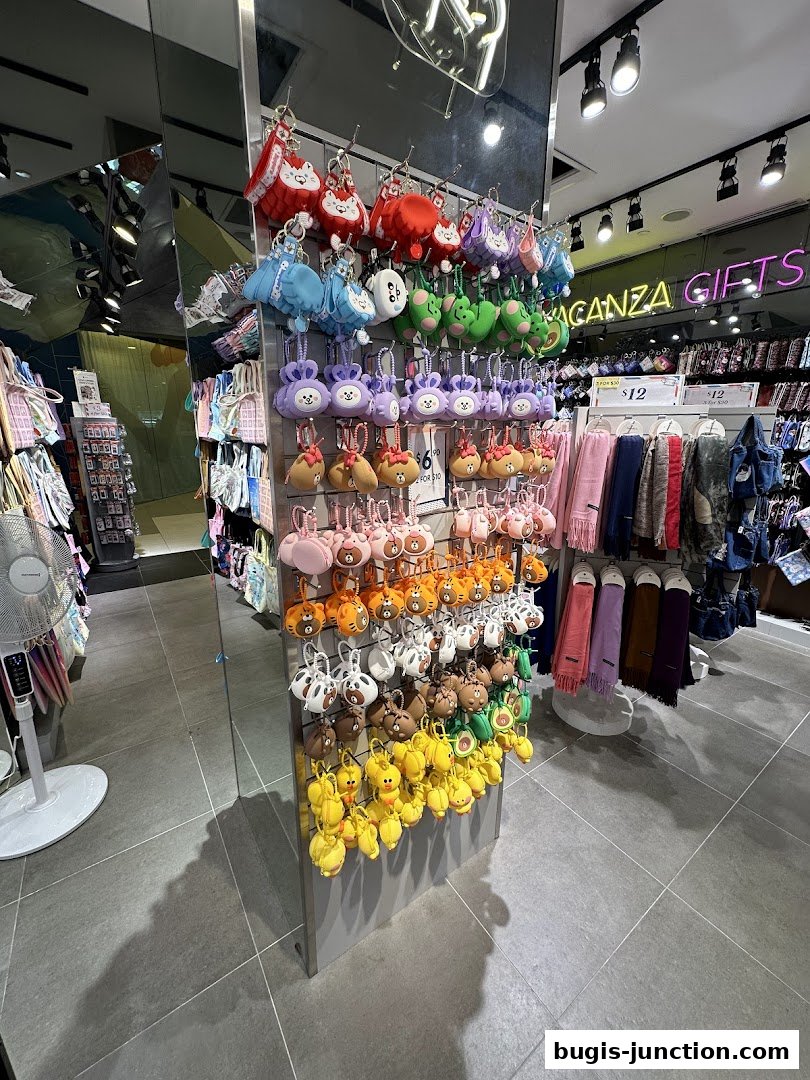 A retail shop interior displaying colorful plush keychains and scarves.