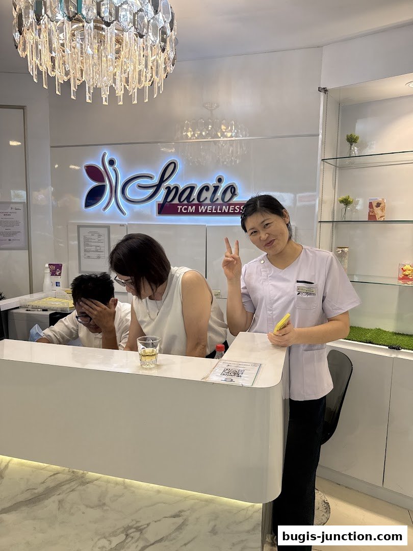 Staff at Spacio TCM Wellness greets customers at the reception desk.