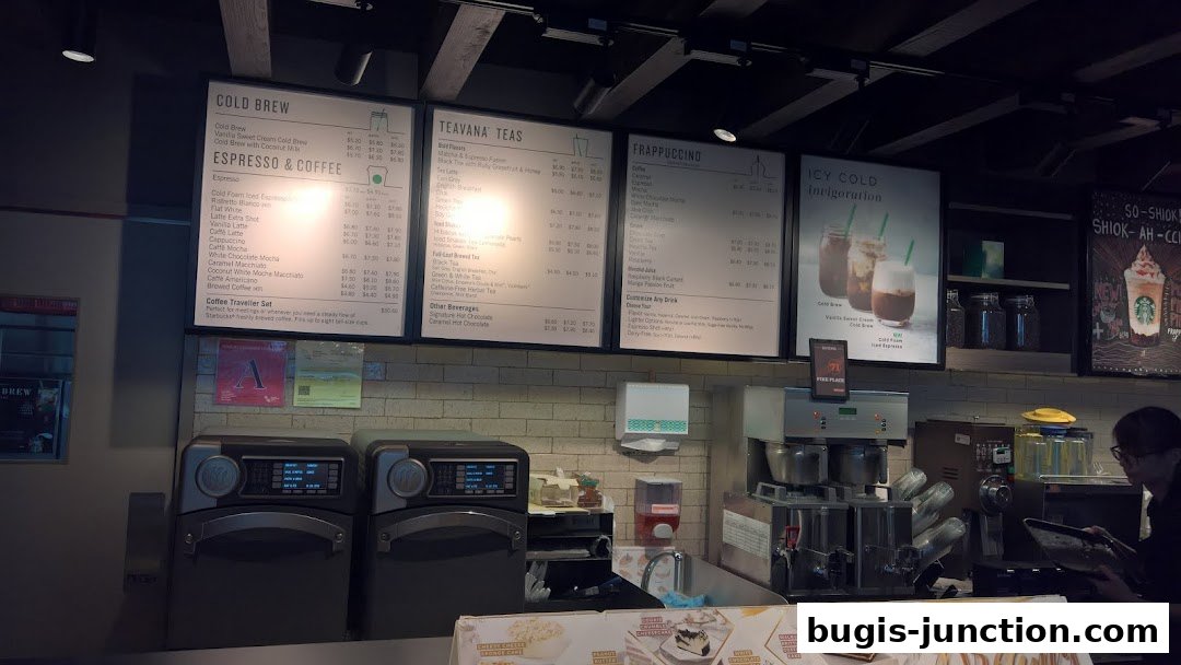 A menu board displaying various Starbucks beverages including Cold Brew, Teavana Teas, and Frappuccinos.