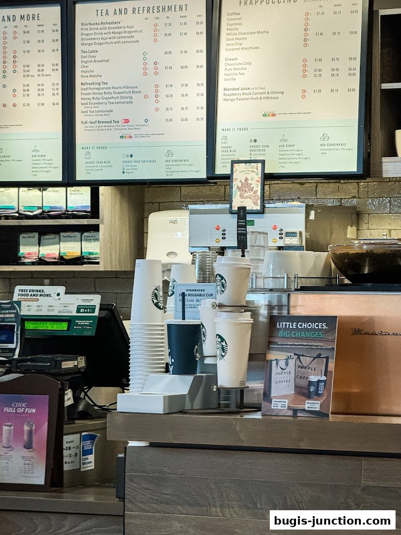 A Starbucks menu board displaying various teas, refreshers, and Frappuccinos with prices.
