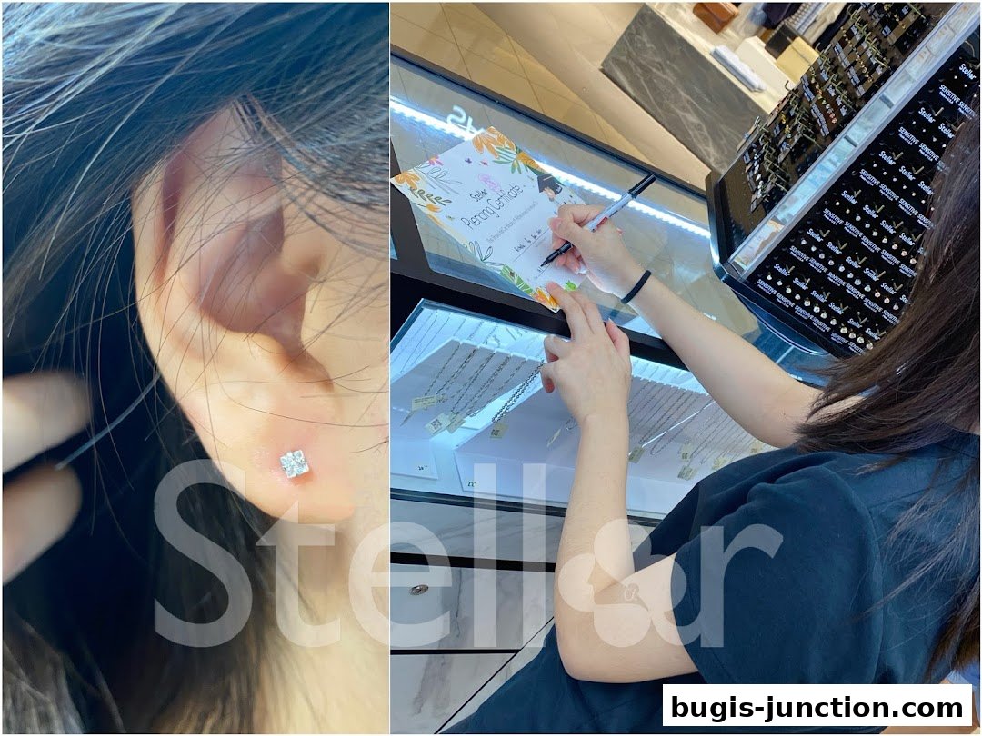 A close-up of an ear with a diamond stud earring and a person filling out a certificate.