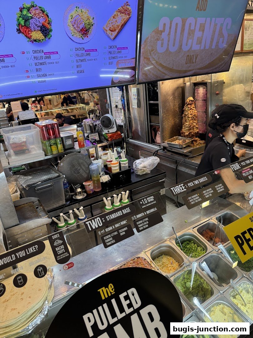 A food stall with a menu board, ingredients display, and a chef preparing food.