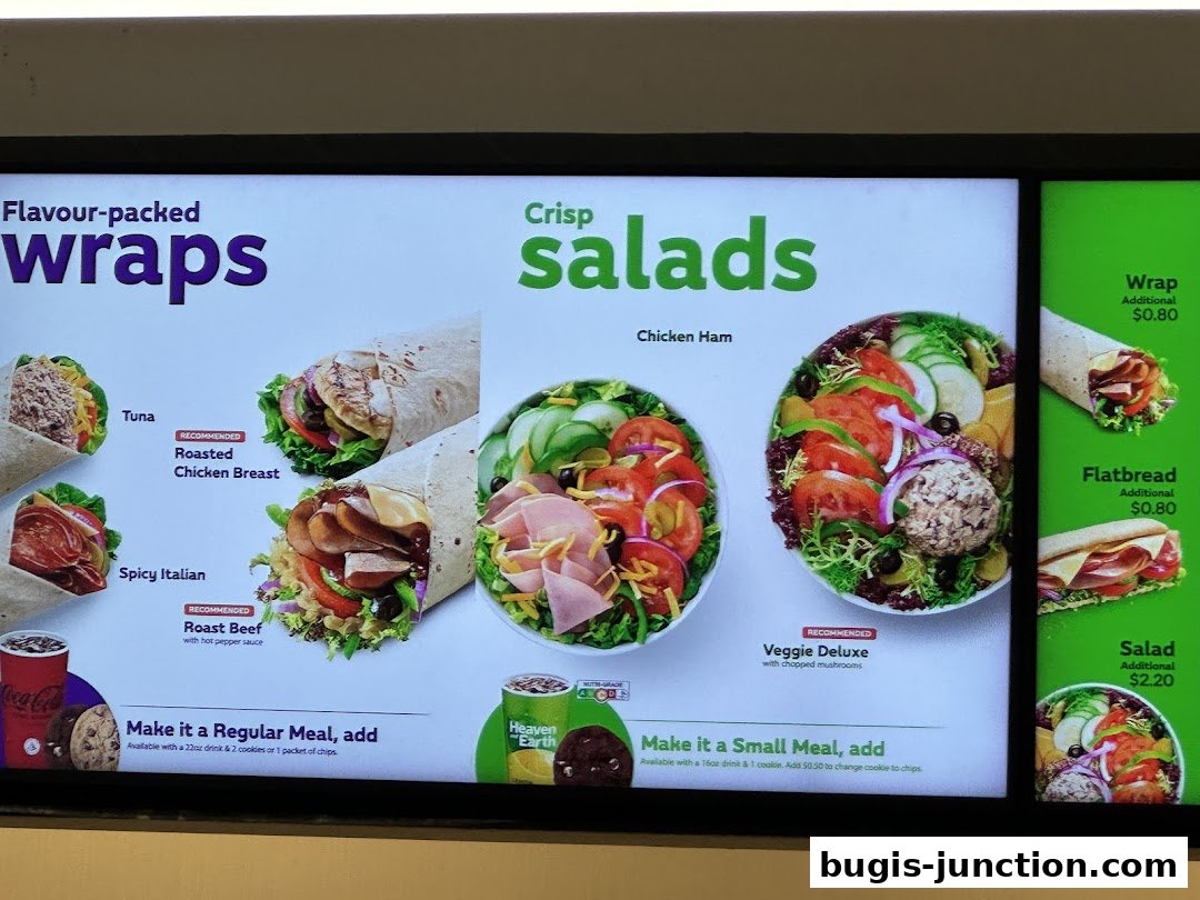 A menu board displaying Subway's wraps, salads, and meal deal options.
