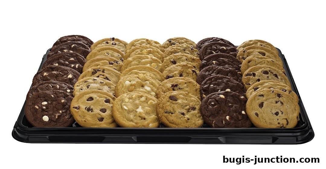A tray filled with an assortment of freshly baked cookies, including chocolate chip and double chocolate.