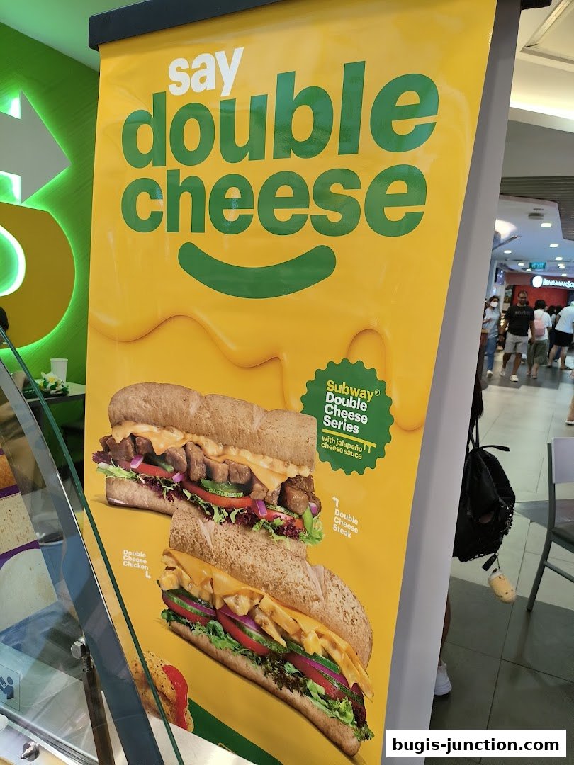 A Subway advertisement featuring their Double Cheese Series sandwiches.